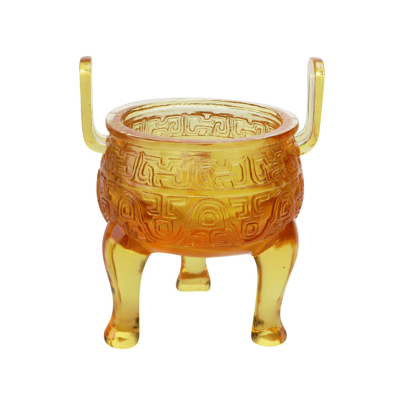 Goudkleurige glazuur statiefornamenten